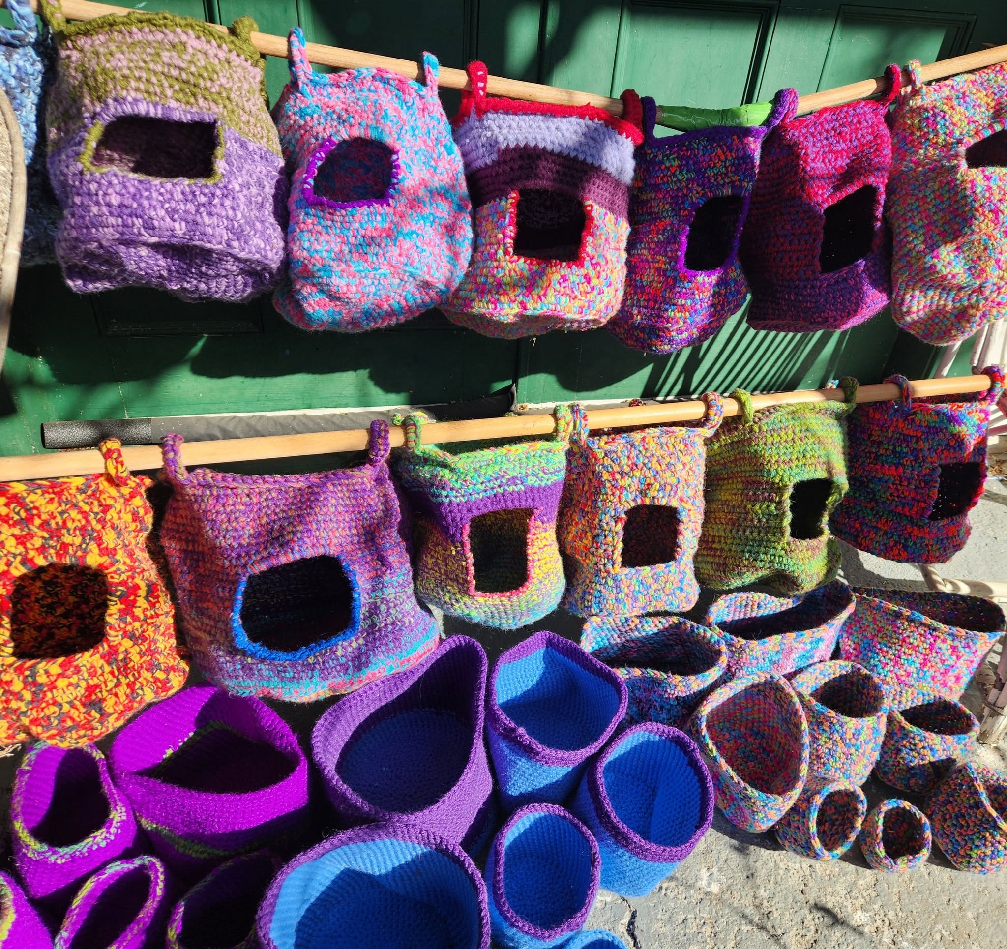 Colourful crocheted possum palaces and sleeping baskets made by Craft Guild member Kazuko Luo